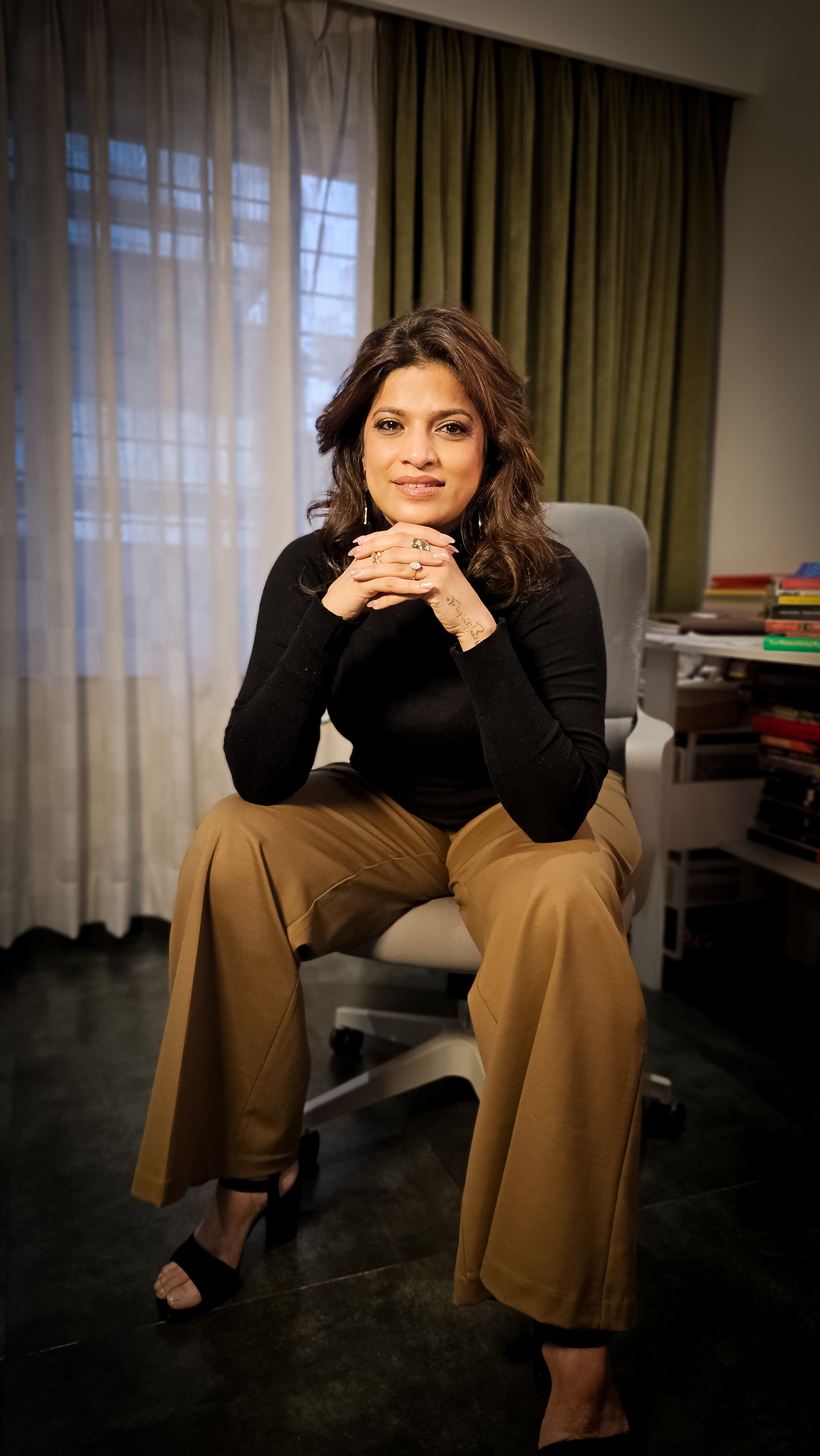 Abhilasha Lonari seated in a black top during an editorial portrait session